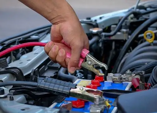 Jumper cables on a car battery