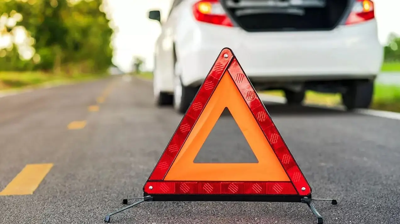 Warning triangle behind a stopped car