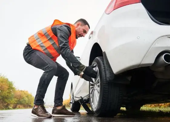 Roadside technician changing a tire